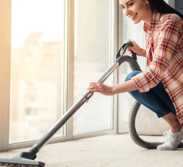 woman-cleaning-carpet | Markville Flooring