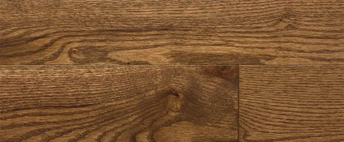 Left: Close-up texture of solid hardwood flooring showcasing prominent, rich natural oak grain patterns and swirling character marks. Right: Close-up view of precision-engineered hardwood flooring planks featuring a smooth, uniform dark chocolate brown wood finish.